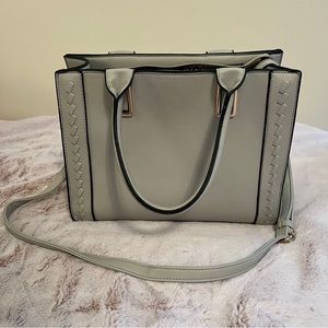 Light gray tote purse. Strap to wear on shoulder. Tan & black spotted interior